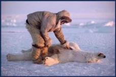 Inuit with polar bear